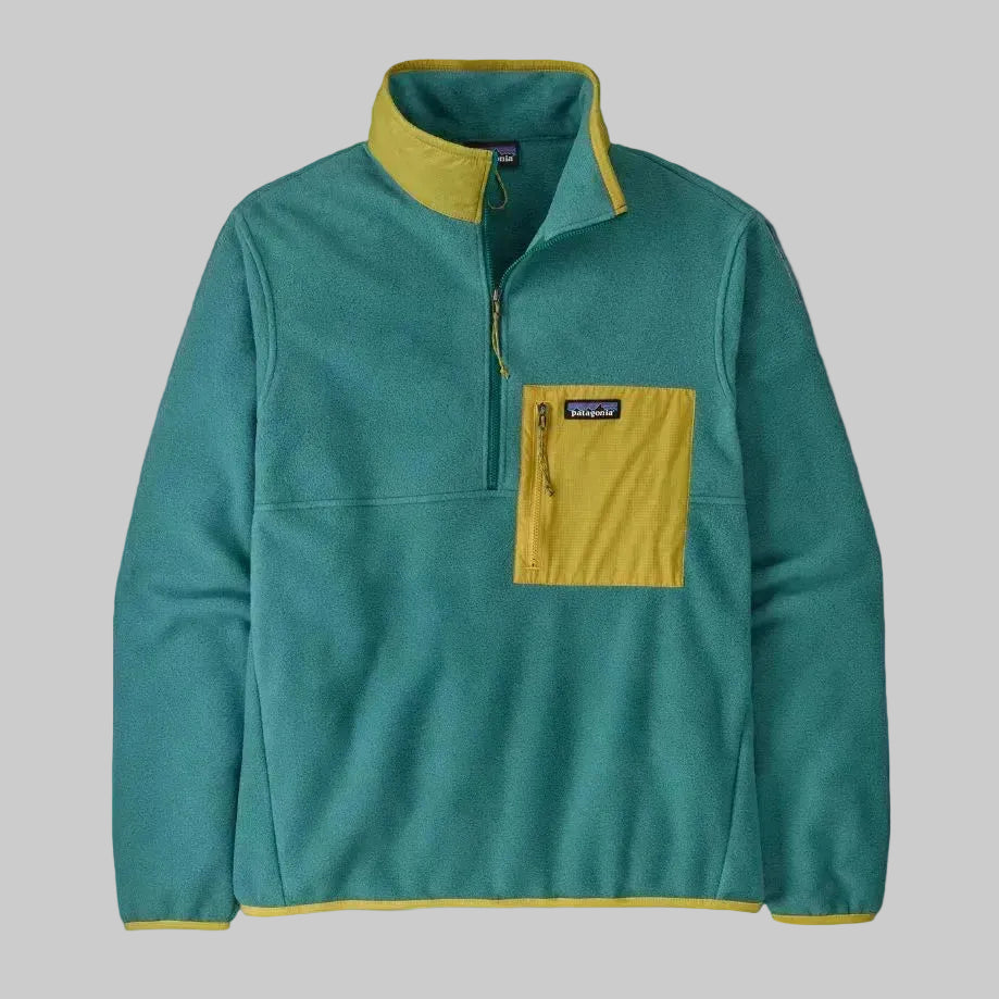 A green Patagonia men's fleece half-zip pullover with a yellow pocket and binding details.