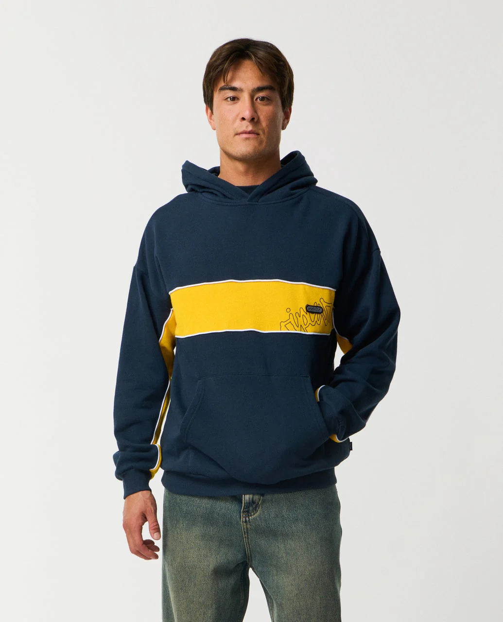 Person wearing a navy and yellow hoodie on a plain background