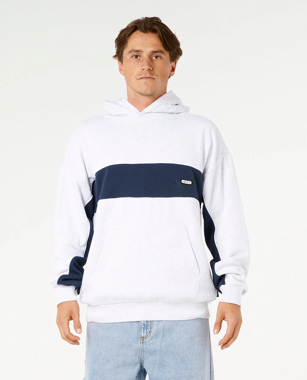 Man wearing a white and navy striped hoodie on a white background