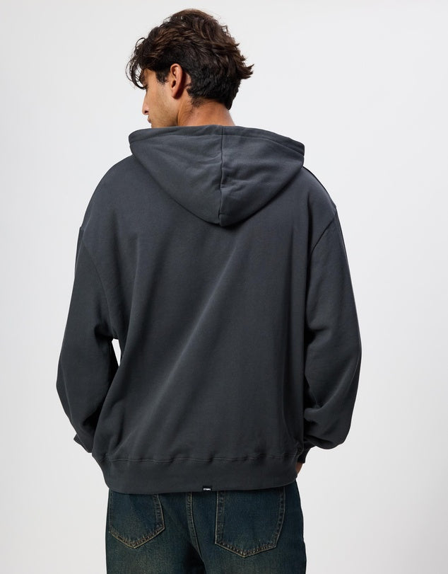 Person wearing a dark gray hoodie from behind on a light gray background