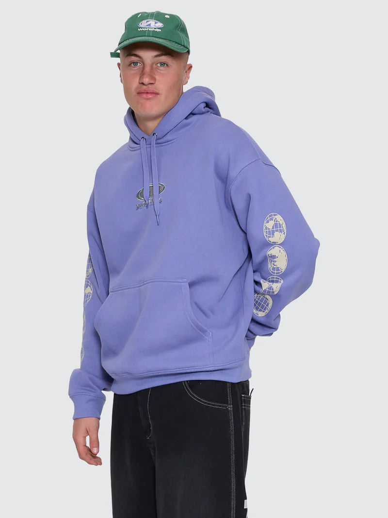 Person wearing a purple hoodie with graphic designs on sleeves against a plain background