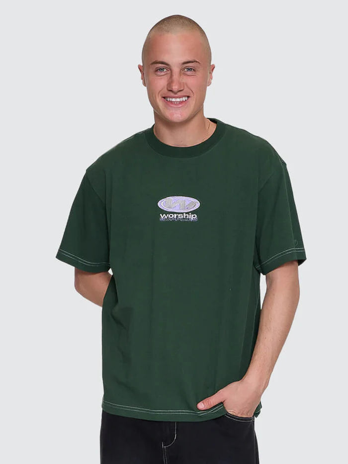 Man wearing a green t-shirt with a logo and text on a plain background