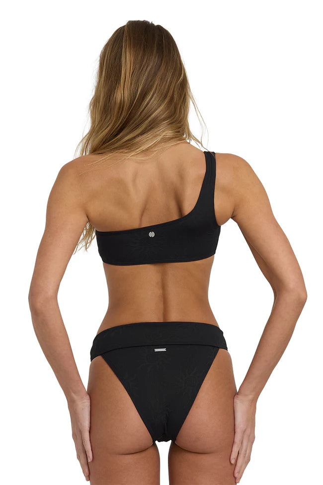 Woman wearing a black bikini set on a white background