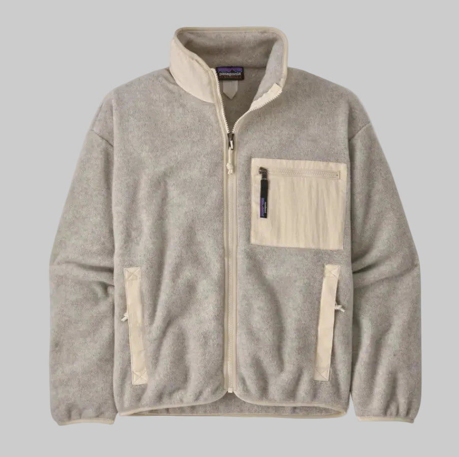A gray and beige full-zip collared jacket with a front zipper and a visible brand tag on the sleeve.