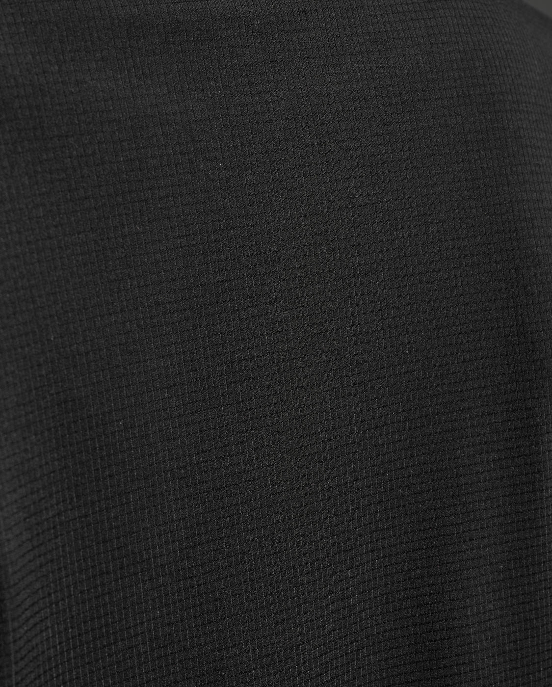 Close-up of a textured black fabric surface
