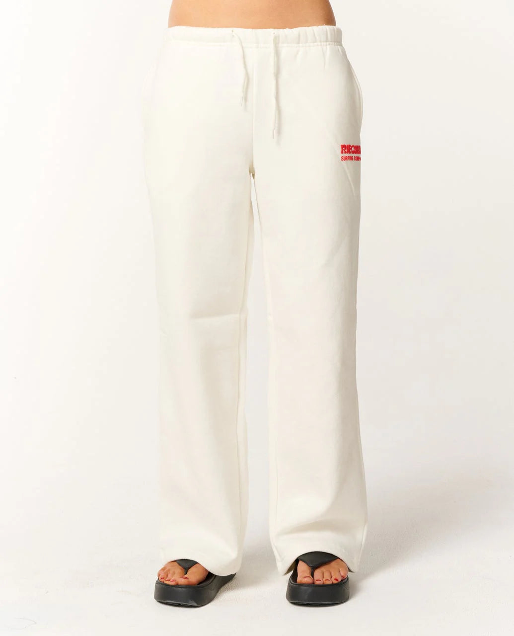 White sweatpants with a red logo on a white background