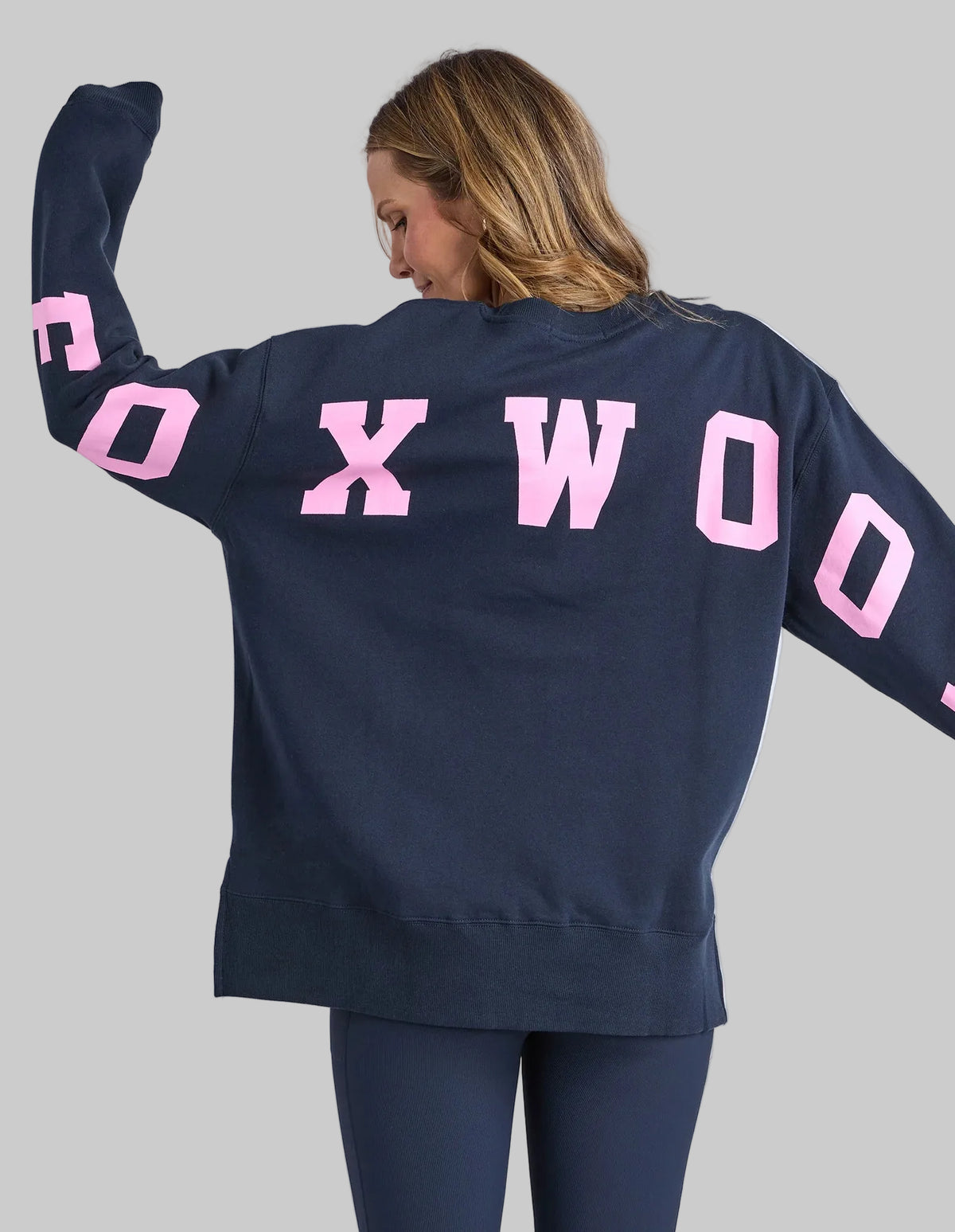 navy blue crew jumper with pink writing foxwood