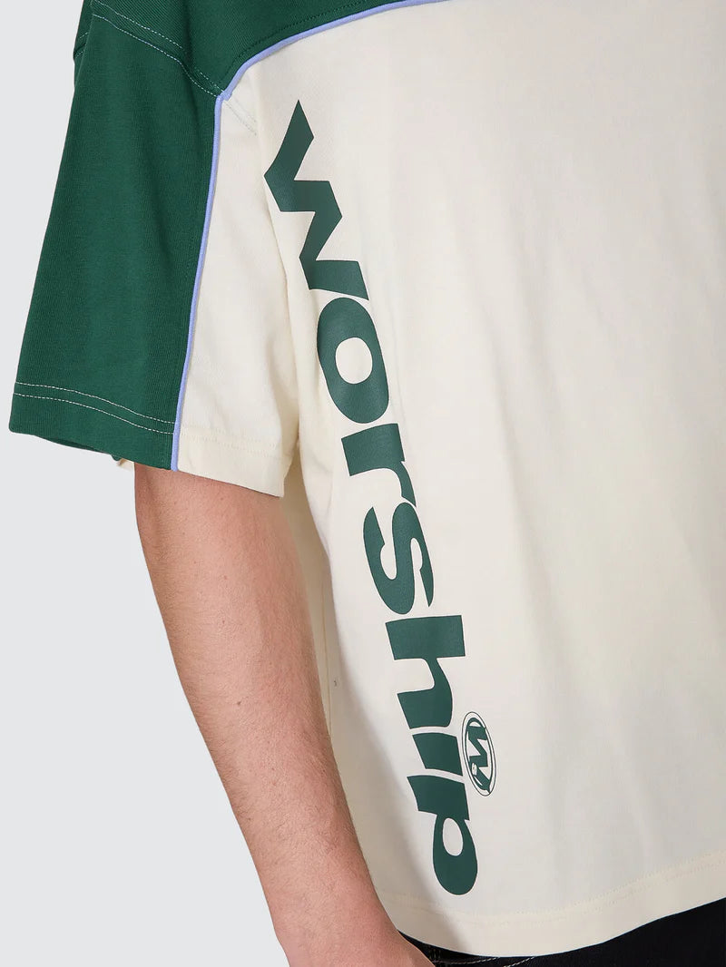 Green and beige shirt with 'WORSHIP' text on a white background